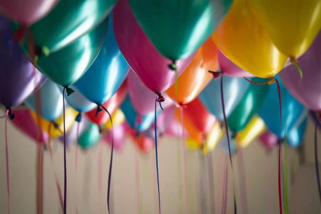 A bunch of different colored balloons.