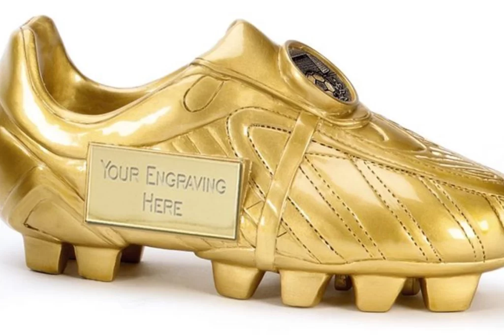 A golden soccer cleat with a spot for engraving.
