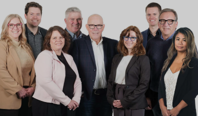 The team of Prime Capital smiles at the camera.